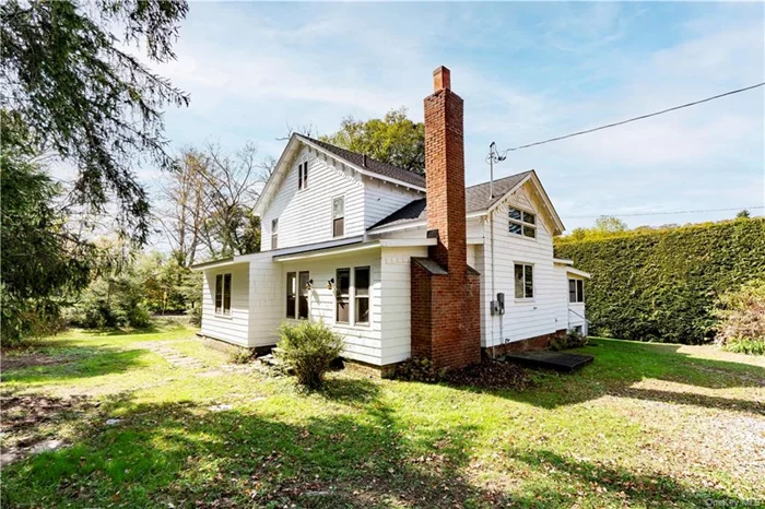 Discover a unique opportunity in the picturesque Historic Hamlet of Moores Mill, LaGrange. This 3-bedroom, 1.5-bathroom house boasts a brand new 50-year roof and upgraded 200-amp electrical service, ensuring peace of mind for years to come. Step inside to find a home with original post and beam construction and impressive architectural details. The first floor features spacious living and dining rooms with 9-foot ceilings, a cozy family room, a kitchen area, a den, and a laundry room, along with a convenient half bath and a screened porch perfect for relaxation. Venture to the second floor to discover three well-appointed bedrooms, each with walk-in closets, and a full bath. The third floor includes a finished attic space with a cedar closet, providing additional storage or a cozy hideaway. Throughout the home, you&rsquo;ll appreciate the character added by the original solid Mahogany bannister, wide plank pine floors, and a staircase leading from the kitchen to the second-floor bedroom. In addition to the residence, this property includes a two-story barn and a mixed-use commercial building currently operating as an auto repair shop. The commercial space features 200-amp service, a waiting area, bathroom, parts wash room, and a two-bay garage with a 10, 000 lb lift, offering endless possibilities for your entrepreneurial dreams. This property is brimming with potential and is waiting for your personal touch. Don&rsquo;t miss the chance to own a piece of history with modern amenities and commercial opportunities!