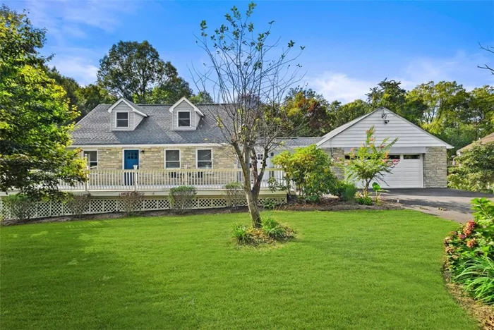 Nestled on a serene, private road in Cortlandt Manor, this meticulously renovated 3-bedroom, 3.1-bathroom home offers an ideal blend of modern amenities and tranquil living. The main level boasts a primary suite for convenient first-floor living, an updated eat-in kitchen, a mudroom with direct access to both the deck and the two-car garage, and a convenient half bath. Beautiful laminate flooring flows throughout the home. The upper level features two spacious bedrooms, a full bathroom, and a cozy sitting area. The full finished basement offers versatile space, including an office, a den, a family room, a bathroom, and a summer kitchen perfect for entertaining. There is also an additional unfinished basement area with utilities and ample storage.  Set on a level, wooded .99-acre lot, the outdoor space offers peace and privacy, while still being part of a small community with one neighboring home. With every detail thoughtfully updated and maintained, this home is move-in ready and waiting for its new owners!