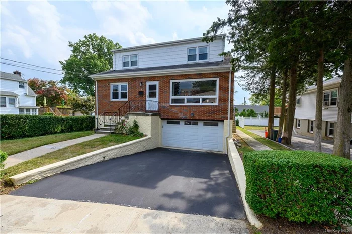 Welcome to this Gorgeous single-family residence in the Centuck neighborhood of Yonkers. A RARE FIND. This house features extra large rooms through out with beautiful red oak floors. Residents can enjoy the amenities of a two-family residence, including a separate entrance to the second floor and a walkout basement. Ideal for families with a vast or extended size. The first floor boasts a formal dining area, a spacious updated kitchen with new stainless steel appliances, three bedrooms,  a walkout basement, and a living room with a magnificent bay window. Additionally, there are two full updated bathrooms with subway tile. The second floor is equipped with two bedrooms, a complete bathroom, and a private entrance. Driveway for two vehicles, in addition to a garage. A lushly landscaped backyard is ideal for summertime entertainment. Roof is 5 years old. Excellent location. Located in close proximity to the RidgeHill retail center, public transportation, highways, parks, and schools. The Tuckahoe train station is located 1.1 miles away and can be reached by foot in 24 minutes.