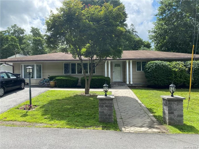 Charming one level home in desirable Mahopac Hills! Take advantage of everything this neighborhood has to offer! It is safe, quiet, friendly, a short walk/drive to the lake and conveniently located! Enjoy many updates including dine in kitchen with built in grill, granite and stainless steel appliances, glistening hardwood floors, as well as updated bathroom with glass tiles and marble vanity. Open floor plan is great for entertaining. The beautiful brick fireplace will help keep you warm this winter! Fenced in, level property. All this, plus lake rights to Lake Mahopac in Mahopac Hills Association!