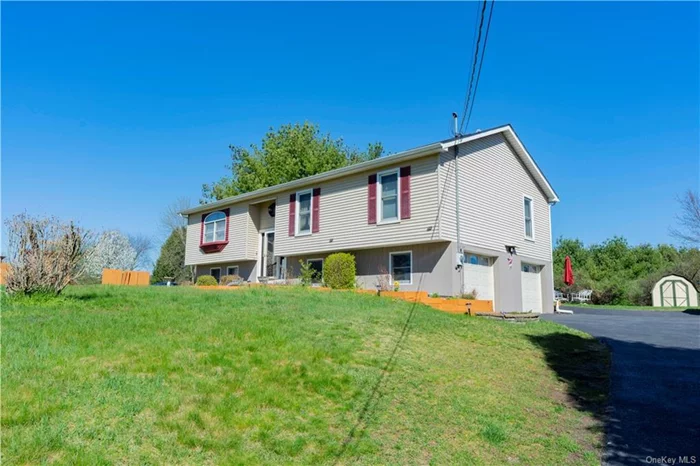 Welcome to 27 Bower Road in the town of Poughkeepsie, Arlington Schools. This large, updated bi-level home features three bedrooms and two full baths on a private half acre. Beautiful kitchen with maple cabinets, granite countertops, island and stainless steel appliances. Formal living room, open dining room , fabulous family room that leads to a back deck for entertaining. The Downstairs adds more living space, laundry, 2 car garage. Propane gas for heat and cooking. Central Air. All furniture is included in the sale. Move right in and savor all the Hudson Valley has to offer!