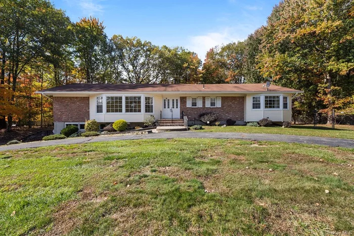 Welcome to this expansive 2, 616 sq ft home, nestled on nearly an acre of park-like property with an inground pool! Step through the tiled entryway into a sun-drenched living room featuring hardwood floors and cathedral ceilings. The dining room flows seamlessly into the eat-in kitchen, complete with granite countertops and sliding doors that open to a deck overlooking the inground pool and spacious backyard. Enjoy cozy evenings in the family room, centered around a charming brick fireplace. The home offers 4 bedrooms, including a main-level primary suite with an ensuite bathroom, and a fully finished basement for additional living space. Don&rsquo;t miss your chance to make this your home! Video surveillance present.