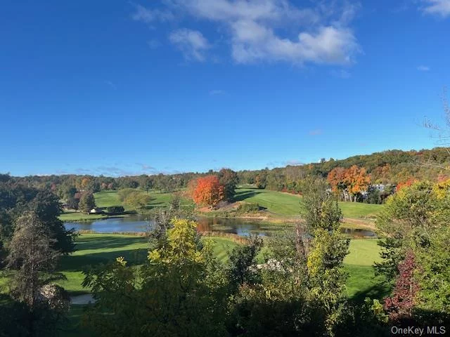 Spectacular Golf Course Views abound in this sun splashed junior four apartment. Delight in sitting on the roomy patio while watching the sun set. This unit boasts an open, flowing floor plan with hardwood floors throughout. Enjoy preparing delicious meals in your updated kitchen with tile floor and plenty of cabinet storage. Entertaining in your resplendent, spacious living room and dining area is easy. The over-sized primary bedroom has a huge double closet, room for a king size bed and a large window looking out to the golf course. The updated bathroom has lots of storage. Additional bedroom/office space has a closet and amazing view. Indoor GARAGE parking. 5 minute walk to Metro North Railroad, shops and restaurants. You can have it all.