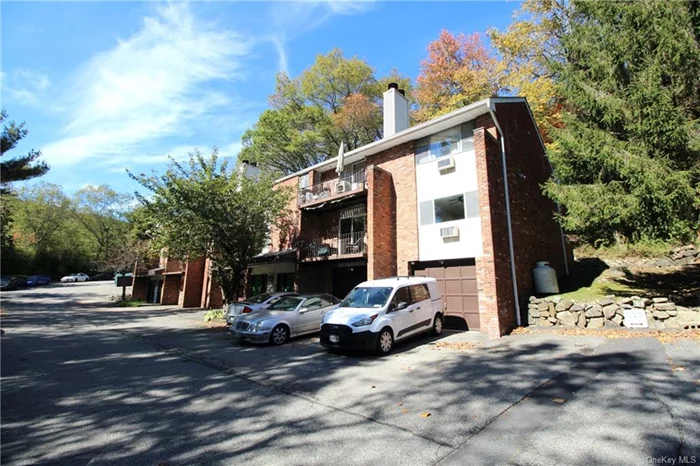 Tuxedo! Upper End Unit! This two bedroom 1.5 bath home is very spacious with plenty of open space and natural light. Enter on the main level and go upstairs leading to the open foyer which takes you to the living area. The living area is bright with a wood burning fireplace and access from sliders onto the outdoor balcony. The primary bedroom includes a one-half bath in addition to the hallway full bath. There are hardwood floors and a full eat-in kitchen. The one car garage is oversized with extra space for additional storage. The common area includes the laundry room.There is easy access to major highways and easy commute to NYC. Monroe-Woodbury Schools.