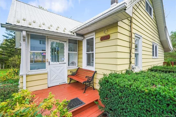 Classic Cape Cod house nestled in Ulster County on Ulsterville Rd. This 3 bedroom, 1.5 bath home has been in the same loving family for many decades. Front enclosed porch invites you into this home that is just waiting to be updated. Hardwood floors and beautiful hardwood trim adorn this home and remind you of how well built these pre-war homes are. Efficient floor plan large living room, den, bedroom, half bath, full bath and large kitchen all on the first floor. Up the stairs are 2 bedrooms. Off the kitchen is a pantry and door that leads you to a porch to the driveway and a large two car garage. The property is beautiful and the driveway is large enough for multiple vehicles.