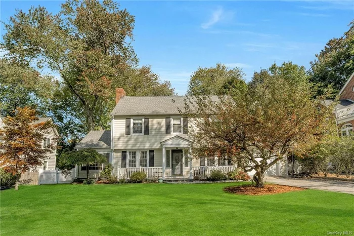 This beautifully renovated Colonial featuring a charming rocking chair front porch offers the perfect blend of modern luxury and classic charm. Perfectly situated just a short walk to schools, Scarsdale Metro North and quaint village shops, this gracious light filled home radiates elegance throughout. The state-of-the-art chef&rsquo;s kitchen features Thermador appliances, custom paneling, expansive quartz countertops and oversized island, creating a perfect space for culinary enthusiasts and easy entertaining, seamlessly opening into the family room. The bright formal dining room, inviting living room with a wood-burning fireplace, sunroom, two dedicated home offices, and a lovely powder room complete the first level. Unwind upstairs in the luxurious primary suite with custom built-in walk-in closets. The spa-like primary marble bathroom is a true retreat, with dual vanities, oversized custom tiled shower and stylish jacuzzi tub overlooking the beautiful yard. Three additional bedrooms, two bathrooms, and a laundry room complete the second level. The lower level offers plenty of space, featuring a newly carpeted recreation area and separate gym. This exceptional home has it all!