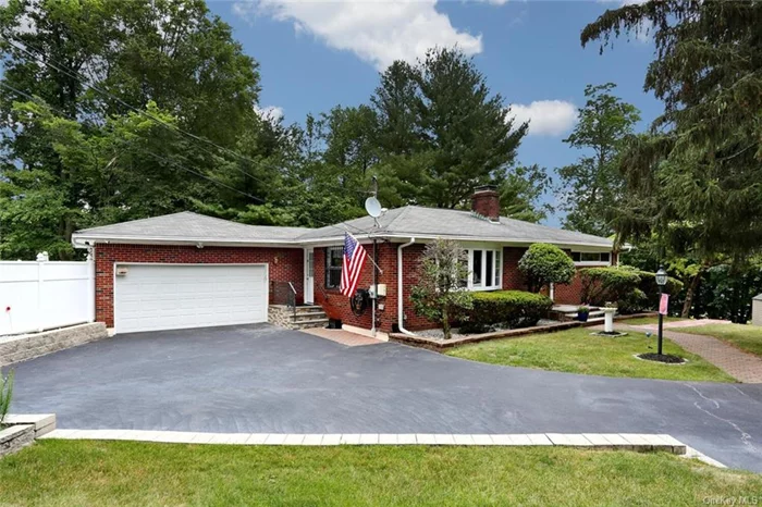 FABULOUS HOME - This beautiful home is a true gem, set on over half an acre of landscaped fenced property. with spacious deck, it&rsquo;s perfect for entertaining and enjoying the outdoors. Inside, you&rsquo;ll find over 2500 sq ft of living space, including a walkout lower level that features a large full bath with double sinks, an office/den, a cozy family room with a gas fireplace, and a summer kitchen. The main level boasts an updated kitchen equipped with stainless steel appliances. The dining room opens to the expansive deck, while the living room offers wainscoting, a wood-burning brick fireplace, hardwood floors, recessed lighting, and a beautiful full main bath. Additional highlights include an oversized heated two-car garage and paver walkways. Enjoy the serene gardens, along with a pear and cherry tree, all within the sought-after Clarkstown School District. Conveniently located near shops, restaurants, and highways.