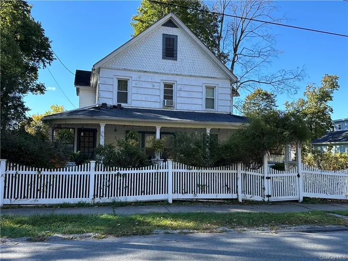 Do not miss this 4+ bedroom home in the Village of Monticello. This old style home has been well cared for by the owner for 2 generations. Boasting 4+ bedrooms, 2 full baths, living room, dining room, large kitchen, hard wood floors, wrap around porch, additional sunroom, meditation room, high ceilings, detached garage, fenced in large back yard, beautiful flower garden, large unfinished basement, municipal water and sewer and more! This home is move in ready and looking for new owners. Just 90 minutes from NYC, a short distance to the bus station, stores and more.   Do not miss this old beauty! ALL SHOWINGS REQUIRE 48 HOUR NOTICE.