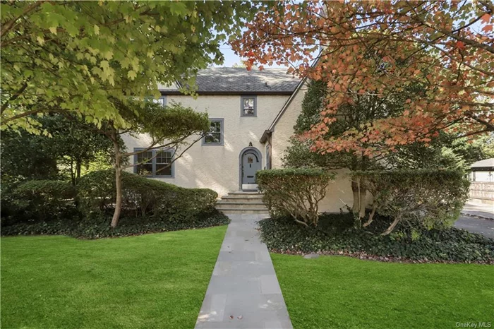 Stunning storybook Tudor perfectly located across the street from Edgewood Elementary School and just a short stroll to downtown Scarsdale shops and the Metro North train for a 32 minute commute to Grand Central Terminal. This beautifully built 1929 home has been lovingly cared for by the current owners for over 50 years. The spacious first level features a vestibule leading to a gracious foyer, fabulous formal living room with a double-height cathedral ceiling and impressive wood-burning fireplace, formal dining room with original built-in cabinetry and Juliet balcony doors, large open plan kitchen/family room with a dining area and French doors to the patio and yard, bedroom/office with a half bath, den/office and a laundry/mudroom accessible from a side entry to the house. The second level boasts a primary bedroom with a walk-in closet, two additional closets and a large en-suite bathroom with a separate tub and shower. Two large bedrooms and a hall bath complete this level. The unfinished lower level includes versatile space, storage and a Bilco egress door. The patio is generously sized and boasts outdoor lighting and access to a level, private backyard and the detached two car garage. Full house generator included. Entire interior freshly painted, stucco exterior power washed and all new light fixtures. This home is in an A+ location, only a short walk to the High School and across the street from Edgewood Elementary School in the highly-acclaimed Scarsdale school district. You can easily walk down or take the public bus to the Scarsdale downtown shops, restaurants and train station. Take advantage of all Scarsdale has to offer including an outdoor public pool complex, town tennis courts and a weekly farmer&rsquo;s market when you make this Edgewood gem your home!