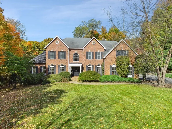 Stately Brick Colonial, located in the highly desirable Leisure Farm Community, offers a convenient lifestyle. Formal light-filled living and dining rooms segue to a huge conservatory with walls of windows, office and a two-story family room with a wet bar and floor to ceiling stone fireplace. The gourmet kitchen with breakfast room provides access to an oversized outdoor kitchen and dining area. The upper level, with a spacious bridge landing overlooking the family room, showcases a grand primary suite with sitting room, bath with soaking tub, double walk-in closets and a large dressing room with island. An ensuite bedroom and a jack-and-jill bedroom complete this floor. The walk-out lower level boasts a full bar and wine cellar with slatted wood barreled ceiling, full bath and family room. Outside, beyond the outdoor kitchen and expansive slate patio is a luxurious vanishing edge pool with spa and an outdoor firepit. An outstanding offering, close to the town of Armonk, schools, and park. 50 minutes to NYC.