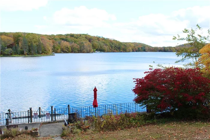 Lake Front Charm on Roaring Brook Lake! This home offers spectacular views from the living room, and dining room! Cozy up to a warm fire in the beautiful living room with stone fireplace, or enjoy the the views outdoors with the large stone patio perfect for entertaining! This beautiful home has 4 bedrooms, 2 full baths, a full basement with a built in bar, 2 car garage,  wood floors on main floor, ceiling fans, granite counter tops, and stainless steel appliances including heated kitchen tile flooring! This home has it all and is a waterfront gem!