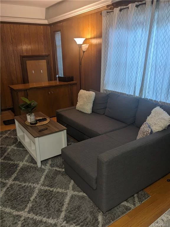 Very large Studio with windows circling the room. Walk-in apartment, unusual and beautiful. Room for bed and lots of furniture. Hardwood floors. One car off-street parking included. Close to train and town!