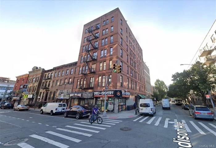 Former barbershop located in a corner building across the street from Marcus Garvey Park.