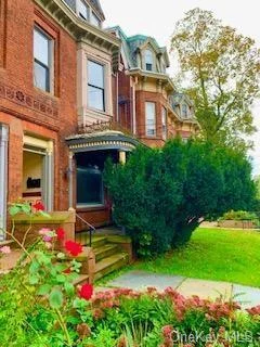 Very bright Brick Victorian with River Views- Located on Grand Street just a short walk to Library, water front shops and restaurants, Public transportation and Ferry crossing to beacon train station to commute to NYC. Legal 2 family home 1st fl is a 2bdrm apt 1bth and 2nd fl is a 4 bdrm and 2 bath duplex apt. live in one and rent the other unit for income. finish bsmnt for possible office or work shop with another full bath. Currently Fully Vacant. Agent disclose interest