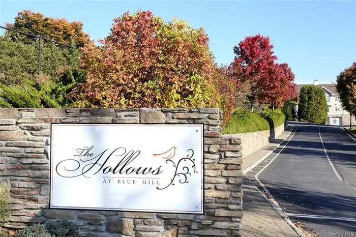 Luxury 2-Bedroom, 2.5 Bath Townhome in The Hollows At Blue Hill Community. Welcome to this stunning, move-in-ready townhome, offering a blend of modern elegance and convenience in a highly desirable community. Perfectly designed for low-maintenance living, this residence is ideal for those seeking comfort and luxury. Key Features Include: Spacious Open Floor Plan with abundant natural light, Oak Hardwood Flooring throughout, Soaring Cathedral Ceilings, Main Floor Laundry Room, Gourmet Kitchen featuring stainless steel appliances, granite countertops, and Custom Decora Cabinetry. Elegant Primary Bedroom with luxurious tray ceiling and en-suite bath, walk-in closet featuring California Closets, Oversized second bedroom with large walk in California Closet perfect for guests or home office. Oversized loft space with adjacent storage closet,  Private patio with awning for serene outdoor relaxation, attached two car garage with GarageTech flooring for convenient parking and storage. Located in a vibrant community offering resort style amenities including a pool, clubhouse, fitness center, tennis/bocce courts and a beautifully landscaped luxury enclave. Enjoy easy access to nearby shopping, dining and recreational options - don&rsquo;t miss this opportunity!