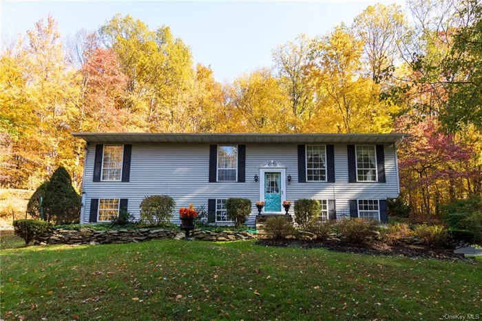 Tucked in the trees and high on the hill this 1978 3 bedroom 1.5 bath Raised Ranch is occupied by the original owners. Those owners oversaw the building of the house each day and ensured the home was built to the highest standards. Throughout the years the property has been meticulously maintained. A beautiful back deck was added off the eat-in country kitchen; a delightful and totally private area to sit quietly and enjoy the beautiful setting and mature plantings. Sunlight streams through the many window in the spacious living room while downstairs the ample family room has a a cozy feeling complete with a propane fireplace. The attached one car garage and work space as well as the garden shed complete the offering on this 3 acre parcel close to both Rhinebeck and Red Hook Villages.