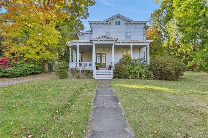 Nestled in the heart of the village of Red Hook, this historic grand Victorian offers the best of both worlds. Only steps away from beloved shops and restaurants, yet over an acre of privacy in the backyard, including multiple out buildings, studio space, in-ground pool and plenty of space to relax. The covered wraparound porch invites you into a classic front foyer and parlor space, which can be used for either business or pleasure thanks to the home&rsquo;s R-20 zoning. This zoning also would allow a Bed & Breakfast usage. There are four separate areas on the first floor that can service as a living room, with plenty of cozy nooks to curl up with a book by the wood-burning fireplace. The kitchen opens into a sunlit dining area and living room, offering openness and warmth. Legally a 9-bedroom, it&rsquo;s currently functioning as a 5-bedroom, 3 1/2 baths, with possible room to grow if you finish the walk-up attic. The home is spacious and bright, with gorgeous original details throughout. Wonderful surprises in the private backyard include a large garden shed, detached 2 car garage with an attached workshop, a large studio space with lofted, beamed ceiling and propane heat (previously an art studio), and two smaller storage rooms conveniently at the far end. Built to last in 1890 and lovingly enhanced for 45 years by one family with care. Recent updates include a new pool liner, oil tank and furnace. Red Hook Schools. Come experience this Victorian dream!