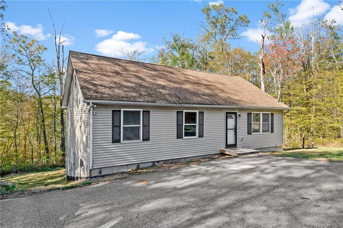 This 2-bedroom, 2-bath home (Lives like a 3-bedroom!) at 647 Lakewood Dr in Pine Bush, NY, offers a peaceful living experience. The property features cozy interiors and spacious rooms, creating a welcoming atmosphere. The well-maintained outdoor spaces are perfect for relaxation or entertaining guests. The home layout is designed for comfort and convenience; cozy up to the fireplace or spread out on the 1/2 acre + land. while the surrounding area showcases stunning natural views and includes lake rights to Pinebush Lake. This property is suitable for both weekend getaways and permanent residence, providing a tranquil setting with access to local amenities such as Legoland, hiking trails, Resort World Casino, and the Kartrite Water Park, among others.