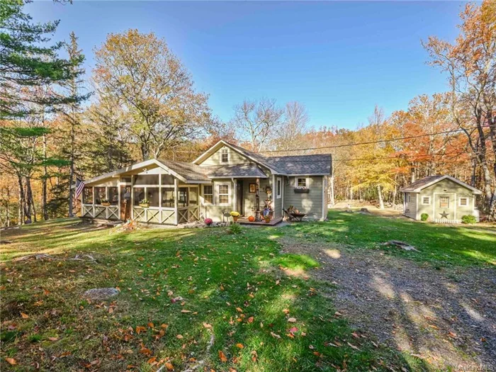 Tucked away, off a quiet mountain road, this exquisitely maintained, early 20th century country home is not to be missed. Extensive woodworking throughout exudes a rustic charm, complimented by highlights such as the stone fireplace and tiled bath. A spacious, screened-in porch allows full enjoyment of that crisp mountain air while offering an extra layer of comfort and protection from the elements. Outside you have the best of both worlds with an easy to maintain lawn and an expanse of wooded landscape. With 3.5 acres available, there is plenty of opportunity for leisurely and recreational pursuits. Additional features include custom built kitchen countertops, hardwood floors, tiled foyer, wood-stove fireplace, jetted tub, scenic stone walls, and exceptional views throughout all four seasons. The area is renowned for its outdoor recreation opportunities, the arts, and fine farm-to-table dining. 15 minutes to Main Street in Pine Bush, 25 minutes to New Paltz, and 1.5 hours to the GWB.