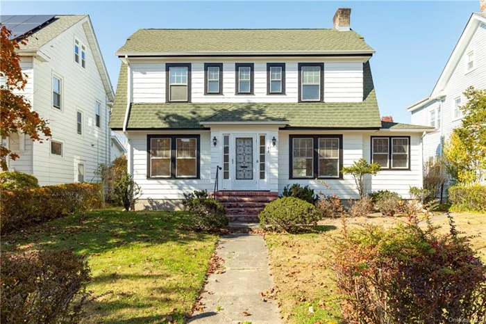 Located in the desirable southside of Poughkeepsie, this charming and well-maintained colonial showcases many original details. As soon as you enter the home, you will immediately notice all the character  from the hardwood floors throughout, the large living room with wood burning fireplace and built in bookcases with reading nook, and sunroom that was used as an art studio by current owner, this bright and airy home really shines. The first floor also has a formal dining room, eat in kitchen with dishwasher and gas stove, large pantry, and oversized half bath. The second floor boasts 3 good size bedrooms, one with cute built ins and desk space, and a large full bath with tub. The attic space is large and has endless possibilities. Outside you will find a fenced in backyard and two car garage. Updates include entire exterior professionally repainted in 2024, New gas furnace system in 2024.  With a little love, this home will really shine! Close to everything and just minutes to Vassar college and Route 9.