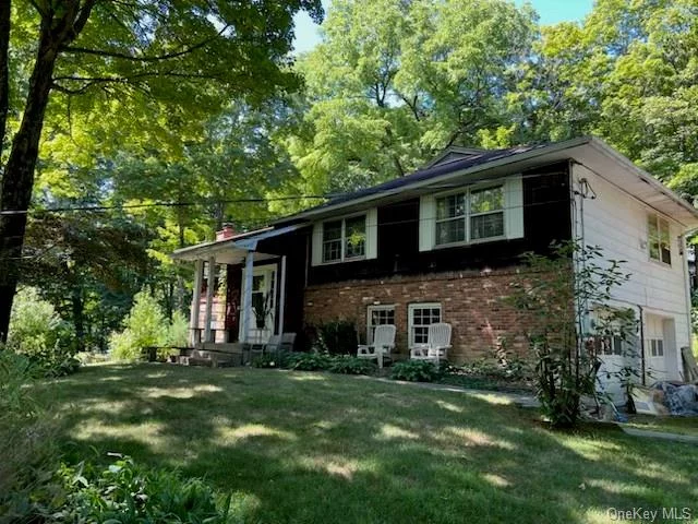 Welcome to this enchanting four-bedroom, two-and-a-half-bath home located in the heart of Cold Spring, NY. This charming property showcases vintage character and presents an incredible opportunity to craft your dream home tailored to your style. Featuring original hardwood floors, this home provides a solid foundation for your renovation vision. A highlight is an expansive yard that offers abundant space for outdoor enjoyment, gardening, or potential expansion. The attached garage adds to the practicality of this property. Please note that the home is being sold as-is, allowing you to realize your creative vision without seller concessions just a short drive to the MTA station.