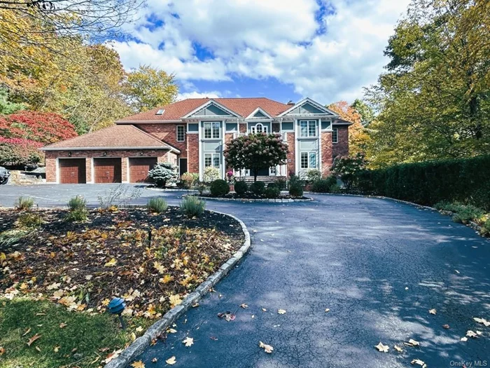 This stunning 5 bedroom, 5.5 bath Colonial sits on 2.1 private acres in a cul-de-sac, offering 5, 652 SqFt of elegant living space. Recently renovated, features a gourmet kitchen with a Viking 6-burner stove, SUB-ZERO fridge and outdoor Lynx grill. A circular driveway with a basketball net and a 3 car garage offers ample parking. The landscaped backyard has a smartphone-controlled Gunite pool, two decks and fencing around the entire perimeter. The walk-out lower level boasts a sauna, 7-seat theater, gym, office and playroom. The home includes a spacious two-story family room, hardwood floors throughout, smart thermostats, internet controlled Insteon lighting and a wood-burning fireplace. Additional highlights: a luxurious master bath steam shower, 20W full house GENERAC generator, Tesla charger, Sonos music system and Honeywell internet controlled thermostats for modern convenience. 3 new AC compressors, new boiler and new pool heater.