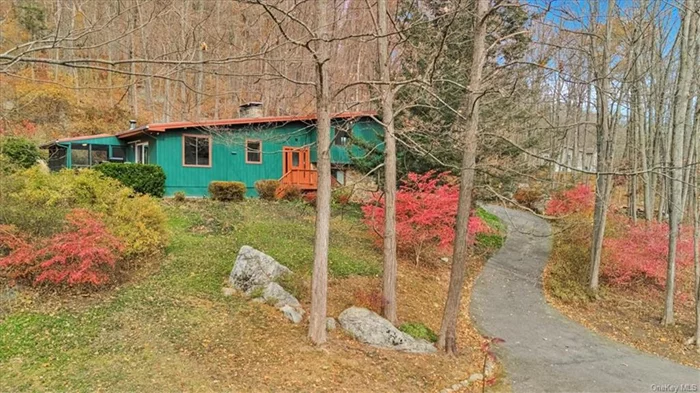 Welcome to a country lover&rsquo;s paradise waiting for its new lucky owners, a Frank-Lloyd-Wright-esque custom built by a local stone mason and other loctalented artisans! This home is the truest gem, ready to whisk you away from the hustle and bustle of NYC, only an hour&rsquo;s drive but worlds apart in tranquility. With the cool, crisp air and the fiery autumn leaves, there&rsquo;s no better time than fall to experience thisdreamlike property, yet every season brings its own magic to this extraordinary place. As you make your way up the picturesque drive, vivid colors surround you, leading you to an abode that feels like a world unto itself. Enter this divine dwelling and experience its immediate charm. A warm entryway ushers you into a spectacular main living space that&rsquo;s the heart of the home. Here, a floor-to-ceiling stone fireplace takes center stage, casting warmth and glow into the room, which is paccented with handsome cedar beams, a cozy sitting area with a state-of-the-art Vermont Castings wood-burning stove, and wide windows that bathe the space in natural light. This grand room exudes a perfect mix of rustic charm and mid-century elegance. Continue to a sprawling eat-in kitchen and dining area, equipped with ample cabinetry, gleaming stainless-steel appliances, and abundant countertops. The unique, hand-crafted floor is sure to captivate, adding character and flair to this spacious gathering place. From the kitchen, a large, sliding glass door opens seamlessly to connect you to the peaceful outdoors, where a soothing koi pond invites you to pause and relax, watching the graceful fish glide and swirl in a dance that calms the mind and soul. Choose between lounging on the deck or relaxing on the porch, where you can breathe in the fresh air, and feel gentle breezes and soft sounds, and savor uninterrupted views of nature&rsquo;s splendor. Just a few steps up from the kitchen lies the sleeping quarters, where a serene primary suite awaits, complete with a spacious full bath. Two additional large bedrooms, one of which boasts its own fireplace, and another full bath offer room for family, guests, or even a home office setup. But the allure doesn&rsquo;t end there; head down to the basement to find an enormous family room, a third full bath, a laundry room, storage and utility spaces, plus direct access to the convenient garage. This lower level provides flexibility for anything from a media room to a private guest suite. The community enhances this enchanting lifestyle with nearby hiking trails, parks, quaint shops, a pharmacy, delis, doctors, and delightful dining options. A short drive takes you to additional amenities, and for easy commuting, the expressway to the city is only a few minutes away. Every inch of this property and its surroundings promises the good life. Embrace your own happily ever after in this timeless home, too special to be available for long!