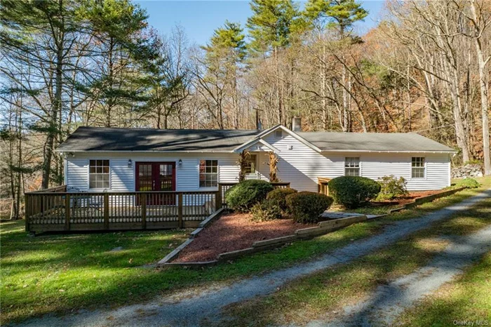 Welcome to 76 Kennel Rd, a charming 2-bedroom, 1-bath ranch-style home in the heart of Cuddebackville, NY! Nestled on 1.8 private acres, this nearly 1, 400 sq ft residence is surrounded by nature and mature trees, offering a peaceful retreat with a host of desirable features. As you step into the foyer, you&rsquo;re greeted by the warmth and character of this home. The inviting home office showcases knotty pine walls, new vinyl plank flooring, and a large picture window that frames the beautiful outdoor scenery. The well-appointed kitchen includes a new ceiling fan, recessed lighting, abundant cabinet and counter space, and a layout that any home chef will appreciate. In the sunken living room you&rsquo;ll find a cozy dining nook, solid oak hardwood floors, french doors opening onto the back deck, vaulted ceiling with exposed beams, and large windows that fill the rooms with natural light, creating a bright and airy atmosphere. This space is designed to enjoy and entertain. Features include new carpeting in the bedrooms, and a versatile walkout basement set up as a workshop perfect for hobbies or additional storage. Outside, the 2-car detached garage, a well-maintained yard lined by a charming rock wall, and an additional outbuilding for storage add functionality and appeal to the property. Located in a prime spot, this home offers both seclusion and convenience. Just a 15-minute drive from town and the nearest highway, you&rsquo;ll have easy access to amenities while enjoying the tranquility of the Hudson Valley. From hiking and biking trails to nearby wineries, local shops, and a train to NYC just a short drive away in Otisville, this property is ideal for NYC commuters or anyone seeking a peaceful Hudson Valley lifestyle. Don&rsquo;t miss the chance to own this well-loved and maintained home. Schedule a viewing today!