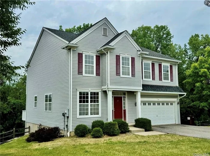 This amazing, spacious 4-bedroom, 2 1/2-bath colonial features an open concept floor plan with hardwood floors throughout. The 1st floor includes a large living room, a kitchen with quartz countertops, a center island, full stainless steel appliances, a dining area with a slider to the deck, a large family room, a laundry room, and a 1/2 bath. The 2nd floor has a master bedroom with an en-suite master bath, 3 additional bedrooms, an additional full bath, and a large room/den outside of the bedrooms, offering abundant space for relaxation and renewal. Additional features include central A/C, a 2-car garage, and a full unfinished walkout basement for future improvement. Conveniently located in a quiet community, this home provides easy access to local amenities, schools, hospitals and major highways.