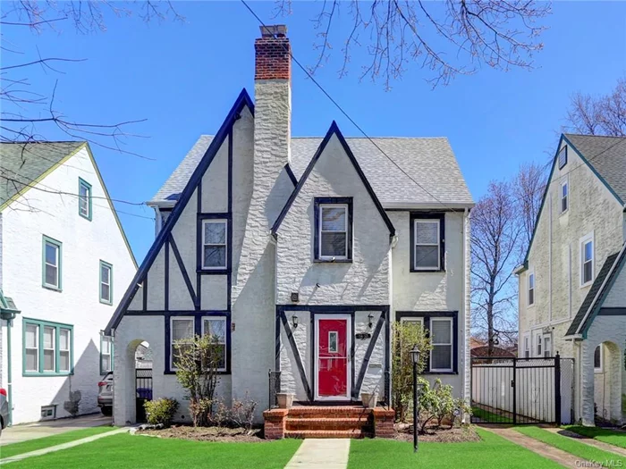 Motivated Seller! Come see this Tudor Style Gem in Addisleigh Park. This oversized home has 4 floors of living space featuring period details and style. 3 Bedrooms, 4 Bathrooms, Eat in Kitchen, Formal Dining Room, Fabulous Master Bedroom Suite, Oversized Closets, and Working Fireplace. Hardwood flooring, arched doorways, and high ceilings throughout. Parking for 5 cars in driveway and detached lofted garage with electric to charge your car. Back yard is fenced, private and peaceful. Lower level is finished with bar, bathroom, laundry room and workshop. New roof in 2018. Custom finishes throughout. Quiet peaceful neighborhood. Half a block from the bus stop for your commute and half a block to the park for concerts and events.