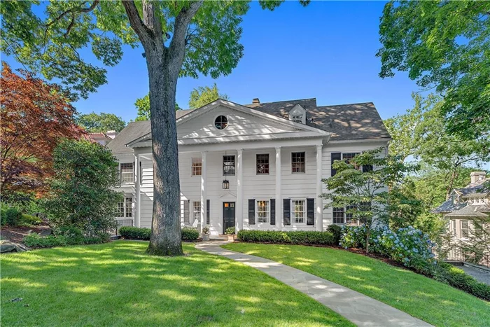 Discover this pristine center-hall Colonial nestled in one of Bronxvilleâ€™s most prestigious estate neighborhoods. Thoughtfully designed and impeccably maintained, this home features a spacious formal living room, a custom den, and an oversized formal dining room that comfortably seats twelve guests, each room graced with its own wood-burning fireplace. The custom eat-in chefâ€™s kitchen, equipped with top-of-the-line appliances and elegant stone countertops, opens to a private outdoor patioâ€”ideal for al fresco dining. A separate powder room completes the first level. Upstairs, the fully renovated primary suite is a luxurious retreat, complete with a cozy fireplace, an expansive walk-in dressing room, and a private office. The spa-like en-suite bath includes a soaking tub, separate shower, and a water closet for added privacy. The second floor also offers an additional bedroom, a hall bath, and a bright family room with its own staircase, conveniently located just above the kitchen. The top floor features three more well-proportioned bedrooms, a hall bath with a shower, and a full-size laundry. The beautifully renovated lower level (an additional 818 square feet not included in the listed total) offers the perfect playroom or media space, with radiant heated tile floors, a temperature-controlled wine cave, a full bath, gym, an additional laundry room, and abundant storage. Set in one of Bronxvilleâ€™s most sought-after neighborhoods, this exceptional residence is just a short stroll from the villageâ€™s shops, schools, and Metro North, combining luxury living with unparalleled convenience.