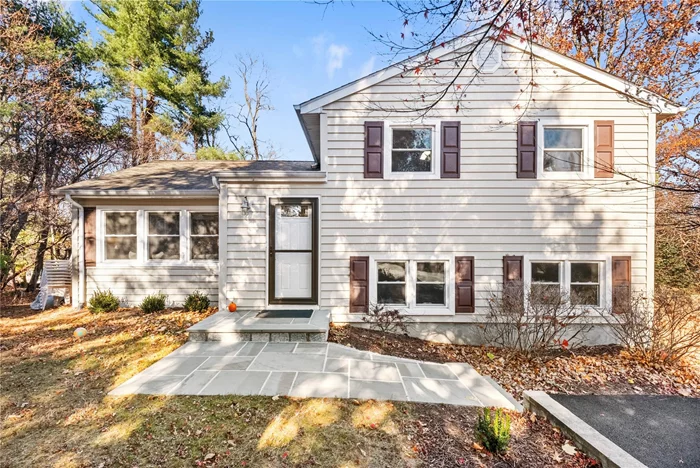 Ready for you to move right in! This well-maintained split-level home is set on a peaceful 1/3-acre lot at the end of a cul-de-sac. It offers 3 bedrooms, 2 full baths, and a bright, spacious living room with a large bay window. The renovated kitchen features quartz countertops and stainless steel appliances, dining area with sliding glass doors to a screened-in porch....The finished lower level provides additional living space, ideal for extended family or a home office. Recent updates include new siding, shutters, windows, furnace, flooring, driveway, and a charming blue stone walkway. With so many upgrades, this home is move-in ready and waiting for you to make it your own!