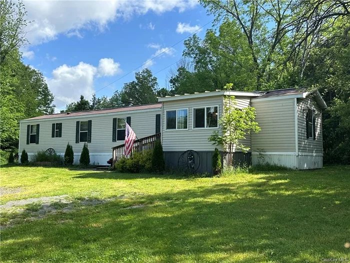 Sweet and cozy home on 1.4 acres in highly desirable Red Hook school district. Located on a nice back road not far from Tivoli and Red Hook villages, this newer manufactured home is perfect for a first time buyer, downsizing family, or buyer looking for an affordable home to grow into on this fabulous piece of land with seasonal Catskill mountain views. Three bedrooms and full bath with tub. Open eat in kitchen and large living area. Home is set back and has wonderful curb appeal with plantings and added mudroom to walk into. Currently rented out and would make a great continued investment property, affordable weekend home in the country, or full-time residence for a local looking to stay in the Red Hook area., AboveGrade:900, FLOORING:Laminate, FOUNDATION:Concrete, Slab, OTHERROOMS:Breezeway, ROOF:Asphalt Shingles