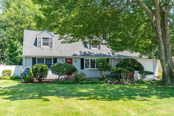 Welcome home! This expansive cape nestled in Huntington Station is situated mid block on a tree lined street, this home features 4 bedrooms, 2.5 bathrooms on a flat half acre of land. The expansive owners&rsquo; suite located on the main floor beckons with a walk-in closet, full bath with a soaking tub and makeup station. Main floor laundry! Huge den with skylights, wood burning fireplace, vaulted ceilings, 1/2 bath and slider to the deck. Entertain with ease in the open concept kitchen that flows into the dining room with deck slider. Both living room and den have wood burning fireplaces. Enjoy the outdoors on the Trex deck overlooking the deep, private, irrigated backyard. Additional conveniences include central air, attached, extra deep 1 car garage with doors on either end tall enough for a boat, and full double basement with outside entrance. Many of the beautiful home furnishings can be included in the sale. Close to shopping, LIRR and major roads. Unpack and enjoy!