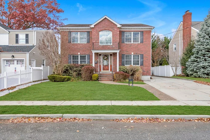 Large & Totally Updated Center Hall Colonial Built in 2005 in Lynbrook SD#20! Wow...this Brick Beauty Sits on a Beautiful Street & Boasts 2408 sqft of living space + a Huge Finished Basement! House features 4 Bedrooms (all on 2nd Flr), 3.5 Baths, Eat-In-Kitchen w/ Center Island/Granite Ctrps/SS Appls, Formal Dining Rm, Family Room w/ Gas Fireplace, Hardwood Floors Thruout, 3-Zone Gas Heat, 2-Zone Central Air, Huge Finished Basement w/ New Flooring & High Ceilings, Alarm & Security System, PVC Fenced in Yard w/ Nice Trek Deck, 4 Car Driveway & 1 Car Detached Garage. Taxes Never Grieved. Be Prepared to Be Impressed! Close to Schools, Parks & LIRR.