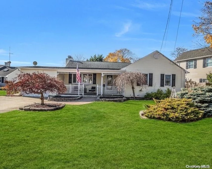 Welcome home to this Immaculate, expanded ranch located in Babylon Village. A covered porch welcomes you. The living room offers vaulted ceilings, a wood burning fireplace, and hardwood flooring. The open concept leads to a bright, large eat-in-kitchen with radiant heat. Radiant heat continues the warmth of this home into the sunroom with beautiful natural light and sliding doors leading to the over-sized property. Bedrooms offer hardwood flooring. A custom, open staircase eases the flow to a tastefully finished basement where you will find your laundry as well as a separate room with ample storage.