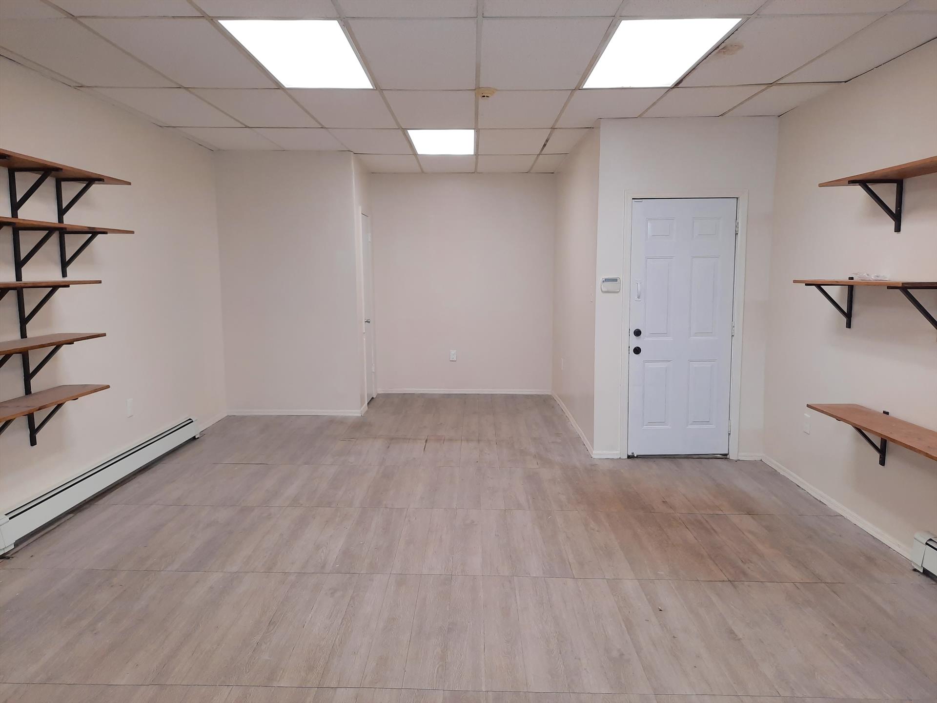 1/2 FEE PAID! Move your business into this lovely Downtown Union City commercial space located on Bergenline Avenue. Features: glass storefront, 2 separate rooms, one in the front and another in the back with small kitchenette with direct access to a large backyard. The front room is approximately: 23'x 17' and the back room is approximately 22' x 20'. Basement storage area included. One full bath and one half bath. Bergenline Avenue, also known as "Miracle Mile", has well over 300 retail stores, restaurants, banks, and has heavy foot and car traffic, and is easily accessible by car and public transportation. Union City is centrally located to Midtown Manhattan and is easily accessible by car and public transportation. Tenant pays their own utilities and is responsible for 33% of water / sewer bill. AVAILABLE ASAP. To make this property yours: $1575 (1st months rent), $3150 (security deposit), $1575 (1/2 broker fee / the landlord pays the other 1/2).