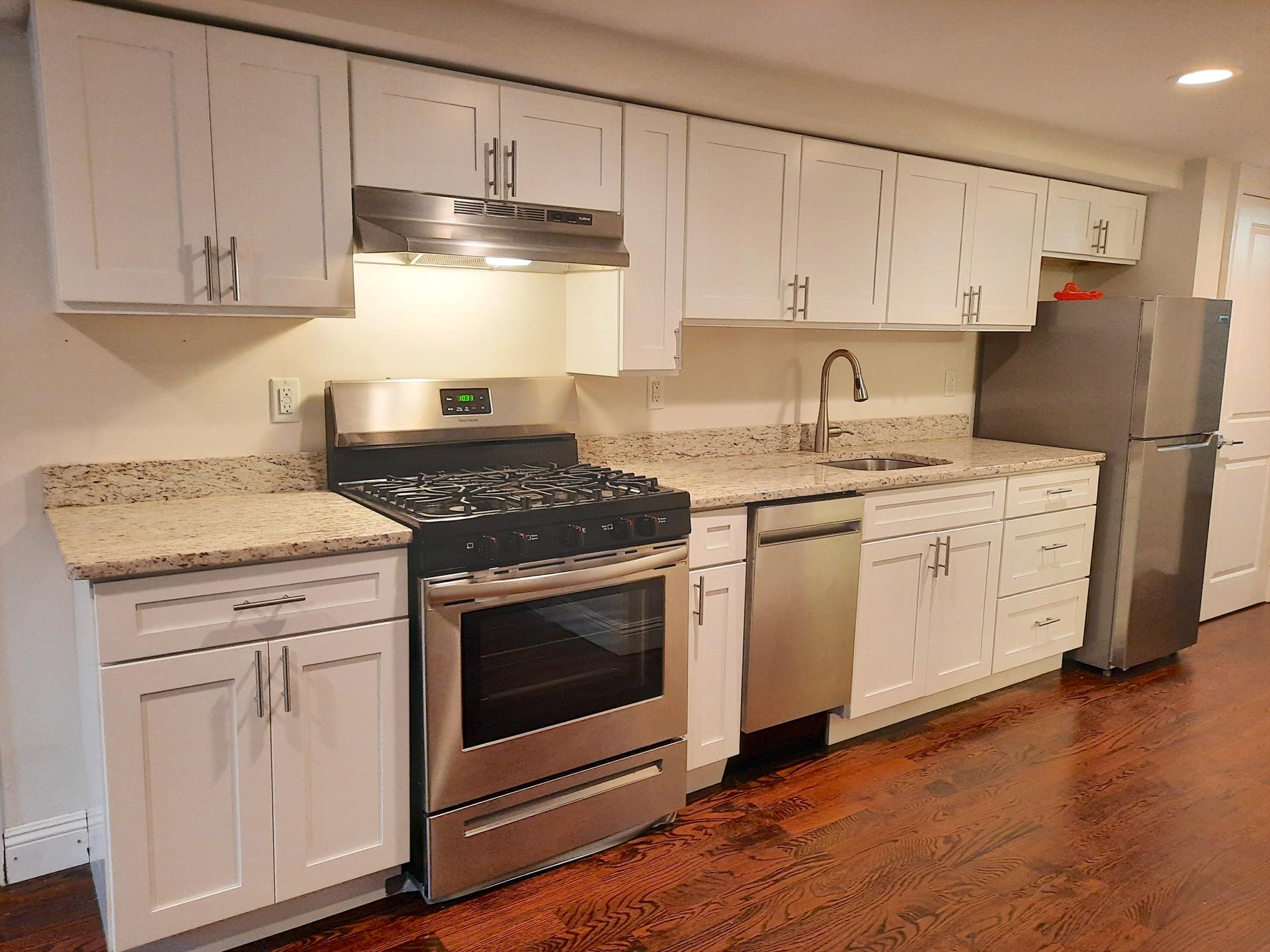 Move into this recently renovated midtown Hoboken 1 bedroom rental located close to the Hoboken waterfront. Features: rich cherry oak hardwood floors throughout, modern open kitchen with stainless steel appliances, granite counters, subway tile backsplash, living room (16.4' x 10'), separate bedroom with closet (10.5' x 9.5'), full bathroom with tub, private washer / dryer, exposed brick, crown molding, GARDEN LEVEL (basement), common yard, 2 blocks off of the Washington Street, close to restaurants, shopping, the Hoboken waterfront, parks, pubs, and public transportation to NYC and other parts. Tenants pays their own utilities. AVAILABLE DECEMBER 15th. NO PETS. Street parking. To make this apartment yours: $2350 (1st months rent), $3525 (security deposit), $2350 (broker fee), $50 (credit check per adult).