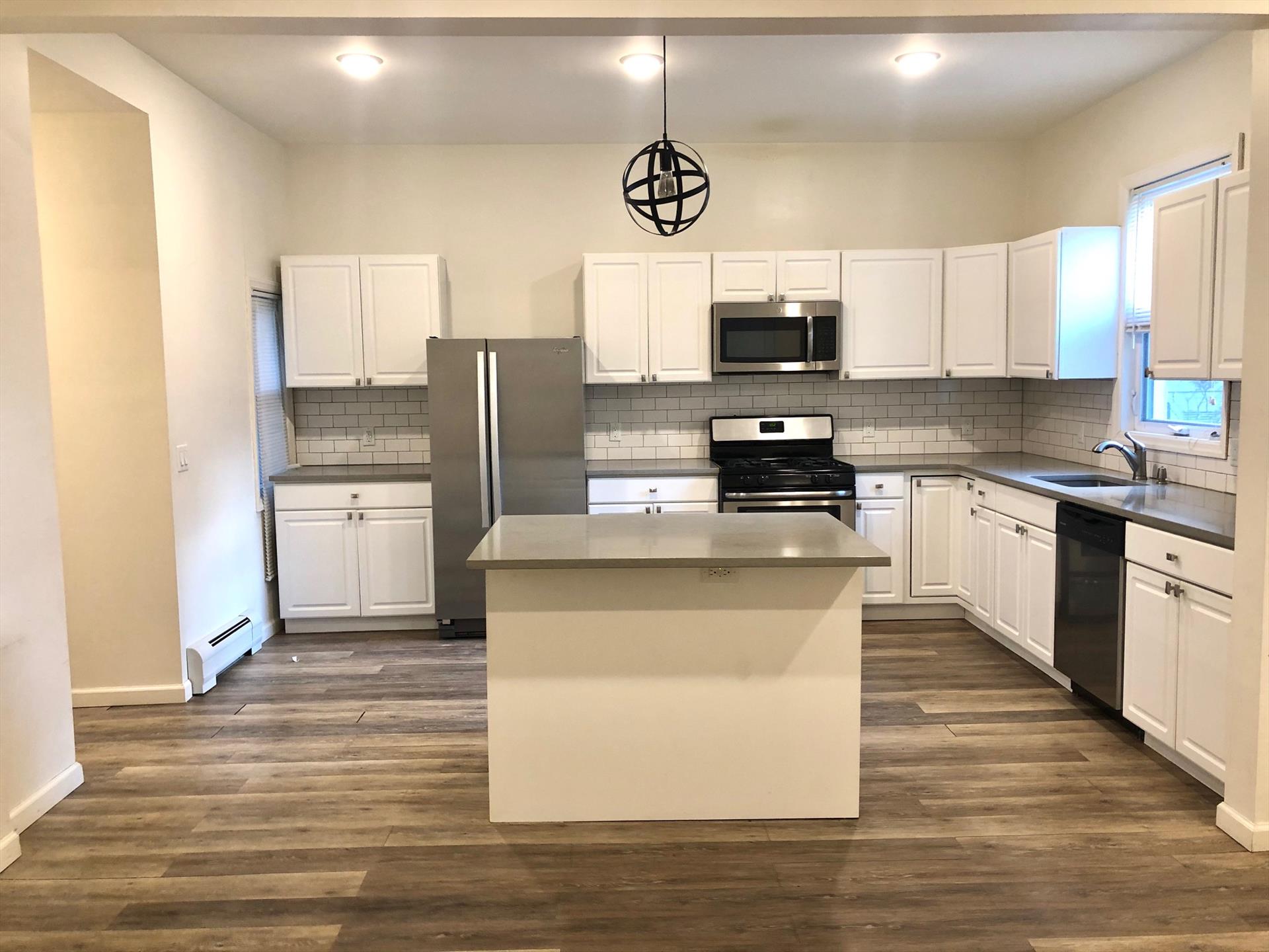 Amazing newly renovated 4 bedroom, 1.5 baths just steps from the Journal Sq Path Station w/ Parking! The apartment features new kitchen with stainless steel appliances, quartz countertops, all new tiles and hardwood floors. Unit also features a beautiful backyard, free laundry in the basement and one parking spot in front of the building included with rent. Available ASAP. one month broker fee.

