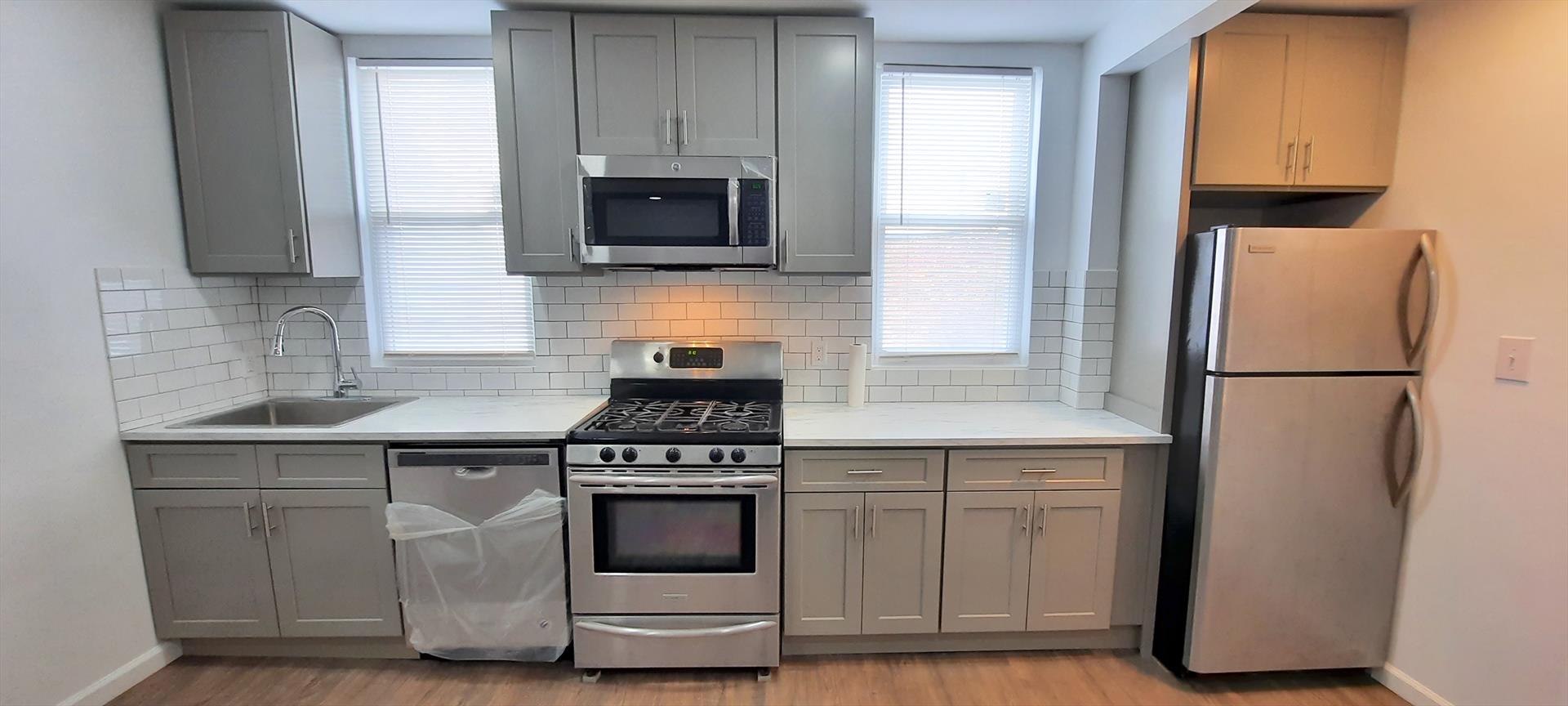 Move into this recently renovated Union City 2 BR rental conveniently located in the Bergenline Avenue business district. Features: great natural light (6 windows), open modern kitchen with stainless steel refrigerator, gas stove, microwave, and dishwasher, living room (12.3' x 9'), 2 separate bedrooms (BR 1: 12.3 x 9.3' and BR 2:13' x 9'), ample closets, full bathroom with bathtub, wood laminate floors, recessed lighting, top floor of a 3rd floor walk up, close to shopping, restaurants, parks, and public transportation to NYC and the Journal Square Path. Water and sewer are included. The tenant pays for heat, hot water, gas, and electricity. AVAILABLE May 15th. To make this great apartment yours: $1850 (first months rent), $2775 (security deposit), $1850 (broker fee), $65 credit check per adult tenant. Tenants must have great credit and verifiable income.  Call Victor Alicea (Liberty Realty) at 917-617-9906 (m) or 201-610-1010 ext. 321 (o), to schedule an appointment.  