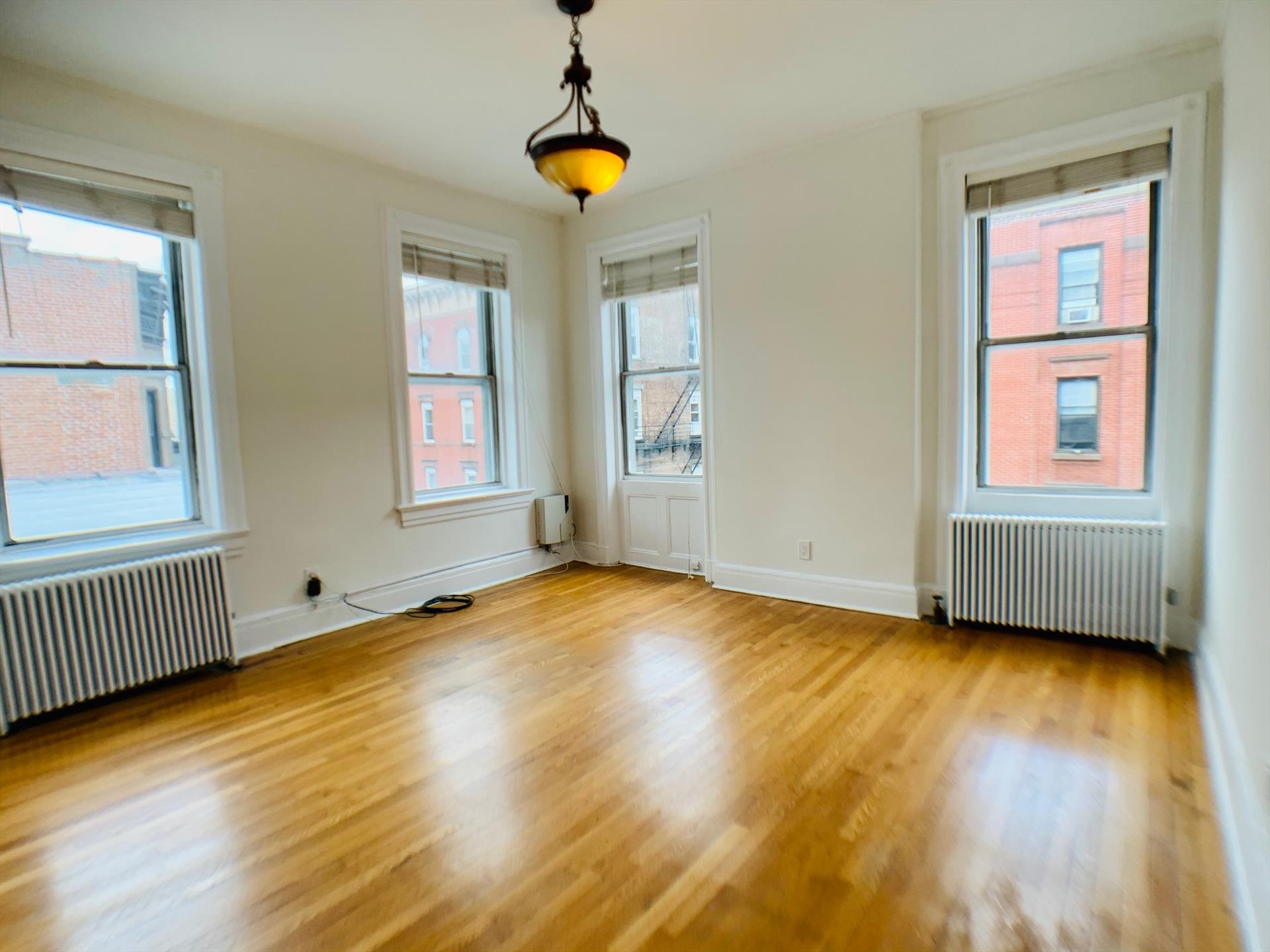 AVAILABLE 2/1 -- Open Studio - Great space - Nice bathroom - Hardwood floors, corner unit which provides a lot of light. Heat and hot water included in the rent. Prime location near shops, dining, entertainment, path, ferry, train, bus, and more! Schedule a viewing today!