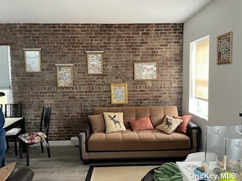 Beautiful 1 Bedroom Apartment w/Living Room/Dining Room w/ Brick Wall, New Wood Floors, Kitchen, Bedroom and Updated Bathroom. Convenient to Shopping and Transportation. Water Included. Street parking.