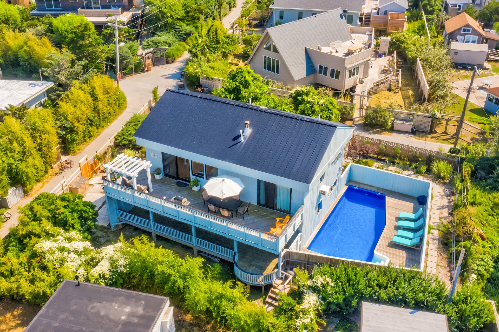 This is a rare find in one of Fire Island’s most desirable neighborhoods. Nestled between Ocean Beach and Ocean Bay Park, this massive Seaview home features a coastal-themed decor. Experience the most breathtaking unobstructed views of the bay from the 2nd story deck. These forever views are guaranteed by the indefinite no-build easement on the property north of this lot. Once you’re done enjoying the bay breeze, step through the 2nd story sliding doors to the open living area. With soaring ceilings and massive windows, light floods the second story with natural light.  The updated kitchen features stainless steel appliances, including a 6-burner gas oven, 42" hardwood cabinets, travertine floors, countertops with penny-round tiles, and a lovely seating area. The living room is home to a cozy wood-burning fireplace, window seats with additional storage, and beautiful custom built-ins. Additionally, there is a master bedroom with an ensuite bathroom and two double closets with sliding glass doors that lead to the deck. When you walk down the spiral staircase you’re greeted by 3 generously sized bedrooms, two of which lead out to the 1st-floor deck. The 1st floor also has 2 full bathrooms and a laundry room. While you’re not at the beach, a mere few blocks away, enjoy the privacy of your own fenced-in pool adjacent to the large first-floor deck. Enjoy this beach home all to yourself or take advantage of the HUGE investment potential in the luxury vacation rental market with a rent roll of $15,000 per week during the summer.  Residents of Seaview have access to the private Seaview bay front park, tennis courts and baseball field.