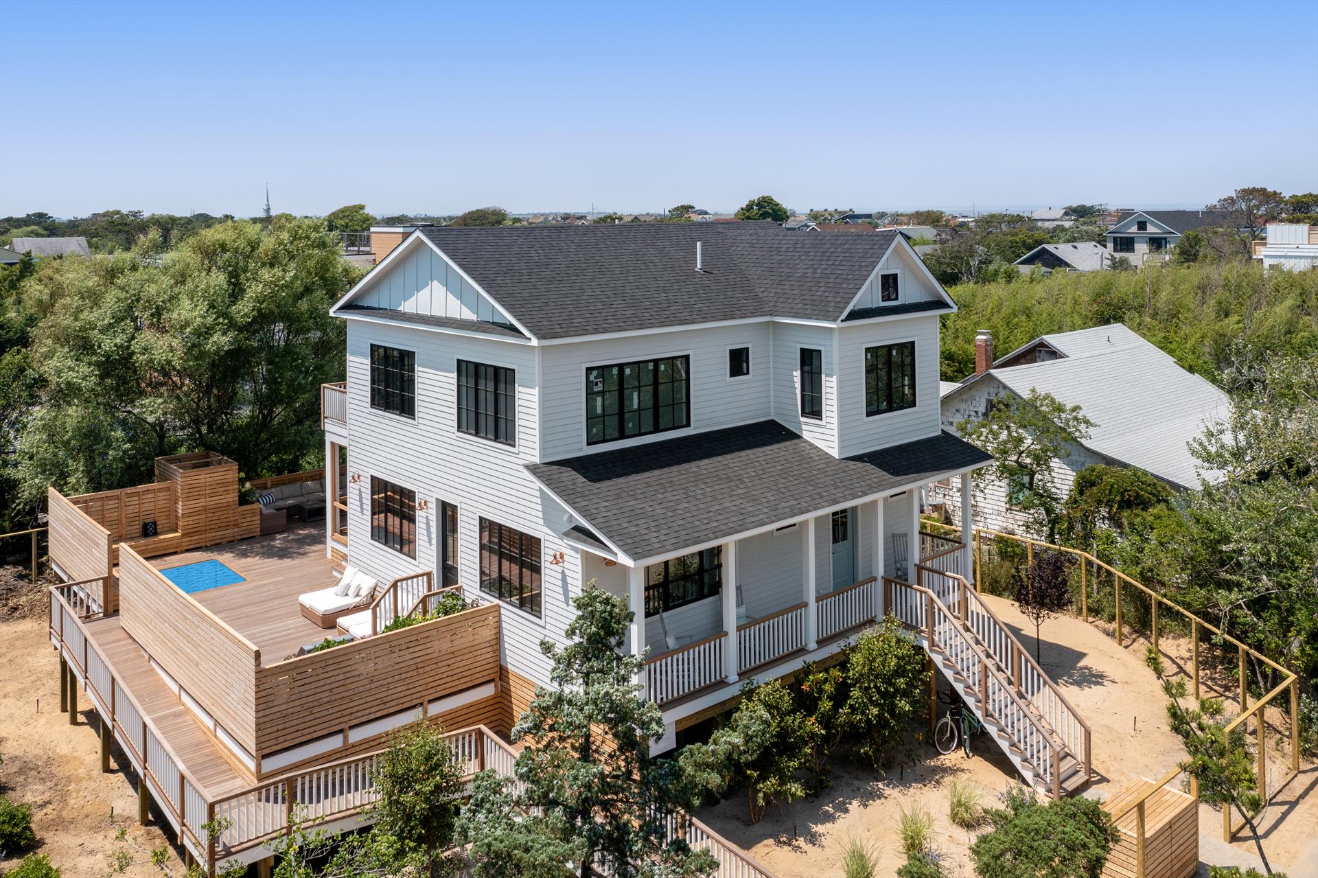 Beautiful new construction home in Seaview, just a 2 minute walk to the beach! This gorgeous new home on an oversized 84’ X 100 lot has it all! Relax in the large open great room with a double height living room and an oversized sliding door leading out to the screened in porch. Chef’s kitchen is beautifully appointed with a Wolf range, 33” wide all-refrigerator and all-freezer columns, walk in pantry, and a 10’ island with room for the whole family to gather around. The home’s 4 bedrooms all feature private en-suite bathrooms. The massive wraparound mahogany deck is nearly 1,000 SF, offering plenty of space to lounge and entertain. Take a dip in the plunge pool to cool down on hot days or grill up a feast at the outdoor kitchen with built in grill. The fabulous main floor primary suite features a walk in closet, and private bathroom with dual sinks, a make up vanity area, and a private water closet. A powder bathroom and laundry/mud room round out the first floor. The second floor features 3 additional bedroom suites, 11’ ceilings, a second laundry room, and a spacious terrace. Ideally located in the highly desirable Seaview community, this home sits in a tranquil location just just 500' from the beach, and also a short walk to the shops and restaurants of downtown Ocean Beach. Enjoy Seaview amenities including clay tennis courts, softball field, playground, children's pool, and lifeguarded bay & ocean beaches.
<br>
<br> Available July 8th - 24th
<br> $13,500/week
