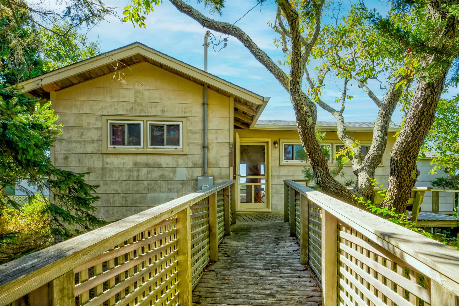 This charming 2-bedroom, 1-bathroom cottage is an ideal Fire Island retreat. Nestled on a spacious lot, the home offers a large deck perfect for outdoor entertaining, whether you're enjoying morning coffee or hosting a sunset gathering. The property provides the opportunity to keep the existing cozy cottage or build your custom dream home. With its prime location near Seaview, you’re close to local shops, dining, and ferry access, while still enjoying a peaceful atmosphere. Just steps from Fire Island's beautiful beaches, this is the perfect getaway or investment property for those looking to embrace coastal living. Don’t miss your chance to own a piece of paradise in a highly sought-after location!