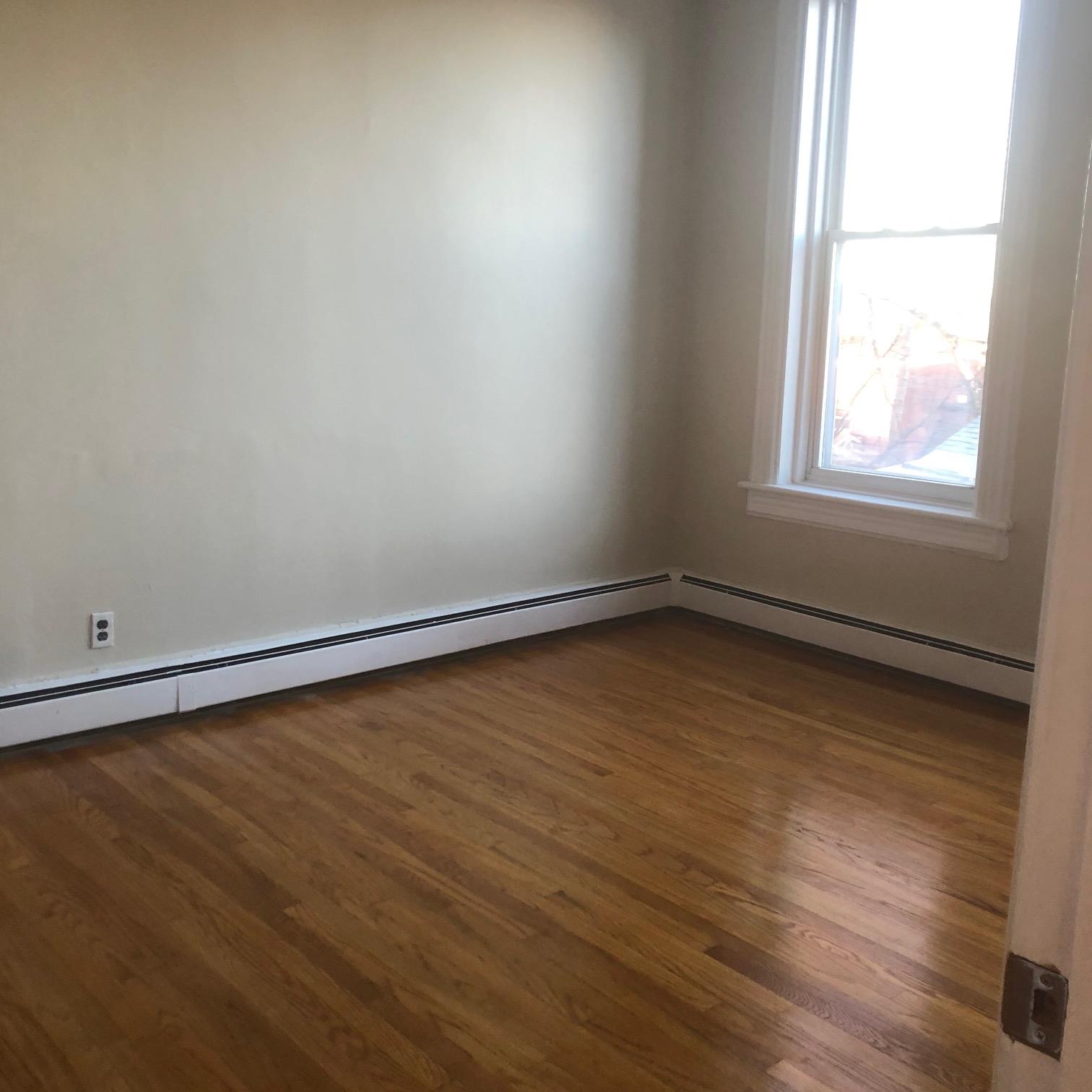 NO FEE RENTAL!!!!  Bright and sunny 1 bedroom apt in really quiet nice part of Bayonne.  The bedroom has a huge closet that is the size of a den.  Directly across the street from the 8th Street Light Rail, easy access to Jersey city, Hoboken, NYC.  Lots of Street parking available.