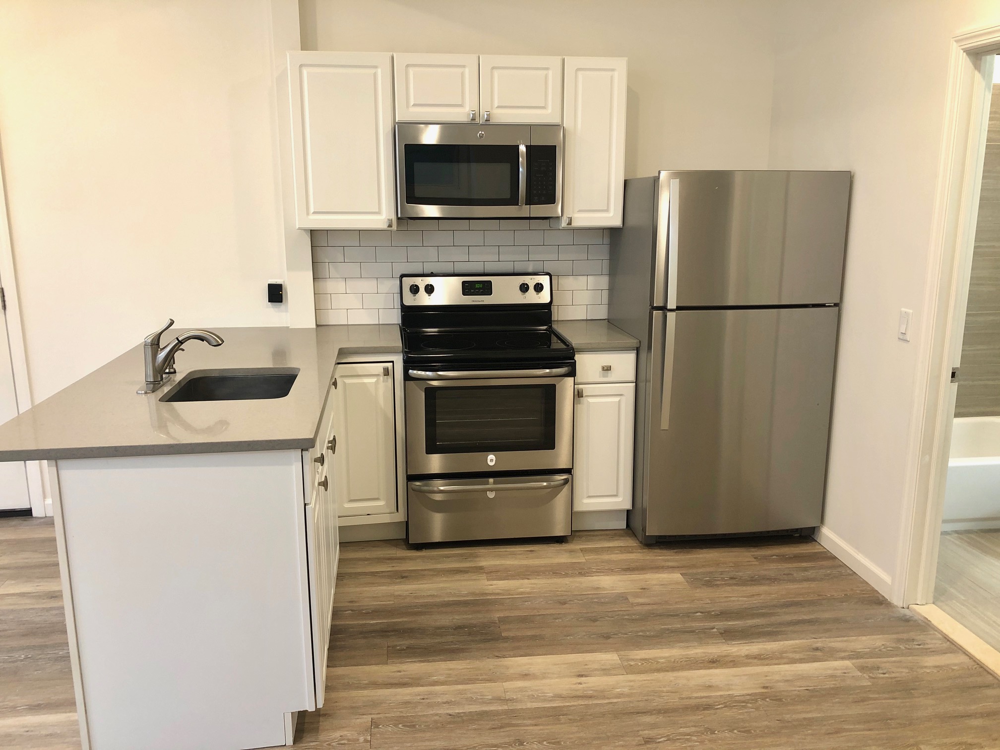 ***No broker fee & Parking Included***Amazing newly renovated 1 bedroom, 1 bath just steps from the Journal Sq Path Station! The apartment features new kitchen with stainless steel appliances, quartz countertops, all new tiles and hardwood floors. Unit also features a beautiful backyard, free laundry in the basement and one parking spot in front of the building included with rent. This apartment is a rare find. **price is based on an amortized rent with a free month on a 13 month lease**