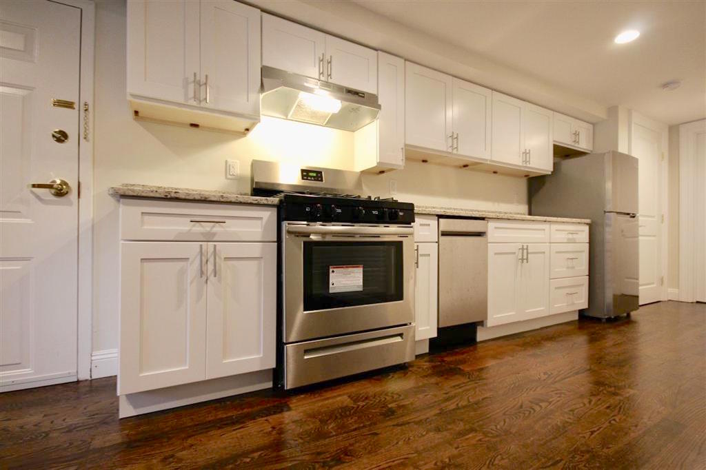 1/2 FEE PAID! Move into this recently renovated midtown Hoboken 1 bedroom rental located close to the Hoboken waterfront. Features: rich cherry oak hardwood floors throughout, open kitchen with stainless steel appliances, granite counters, subway tile backsplash, living room, separate bedroom with closet, full bathroom with tub, private washer / dryer, exposed brick, crown molding, GARDEN LEVEL (street level) with private entrance, common yard, 2 blocks off of the Washington Street, close to restaurants, shopping, the Hoboken waterfront, parks, pubs, and public transportation to NYC and other parts. Tenants pay their own utilities. AVAILABLE ASAP! NO PETS. Street parking. To make this apartment yours: $2300 (1st months rent), $3450 (security deposit), $1150 (1/2 broker fee - the landlord will pay the other 1/2 for qualified tenant), $50 (credit check per adult).