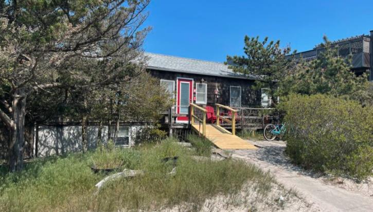 One of the largest lots in Ocean Bay Park!  Enjoy life at the beach in this lovely cottage or build the beach home of your ultimate dreams.  House has 4 bedrooms and 2 bathrooms.  Huge yard with above ground pool that is moveable.  The house is currently situated on a secondary dune, providing a peek of the ocean from the front steps.  Desirable street in Ocean Bay Park!  Only a 6 minute walk to the ferry & downtown Ocean Bay Park.  A 20 minute walk or 10 minute bike ride to the bustling downtown of Ocean Beach.