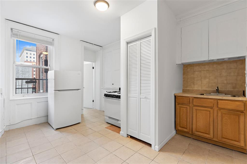 Amazing one bed, one bath plus den in prime location! Unit can also be used as a railroad 2 bedroom with a bonus door at the rear of the apartment. This home features hardwood floors with plans to paint and clean the entire unit along with new vanity! Located on the top floor of the building. NO BROKER FEE!